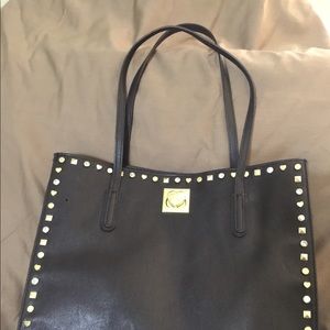 Cute Betsy Johnson studded tote w/heart closure.